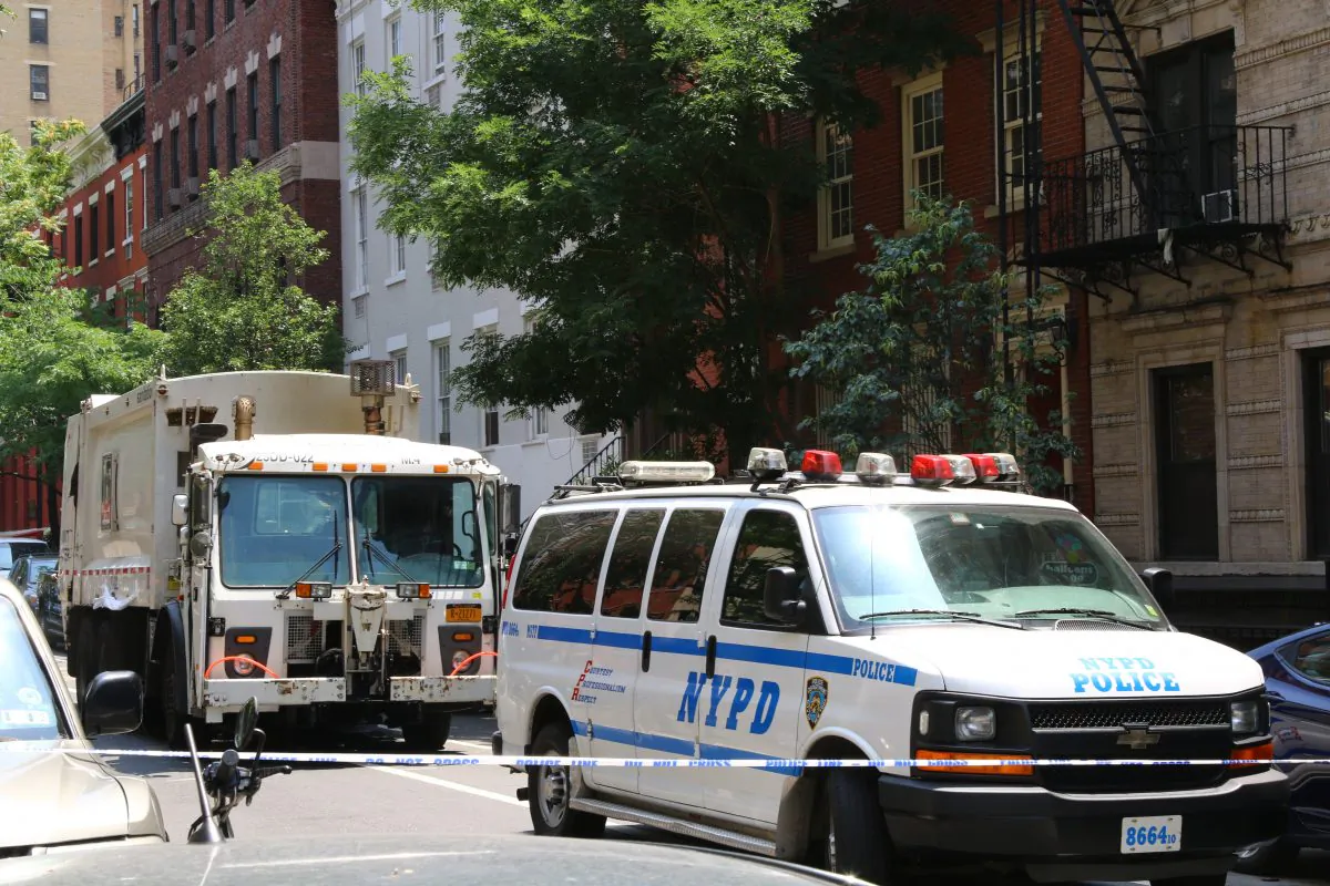 The sanitation truck that killed 58-year-old Jackie Haeflinger in the West Village, on Wednesday, July 3, 2014. (Brendon Fallon/Epoch Times)