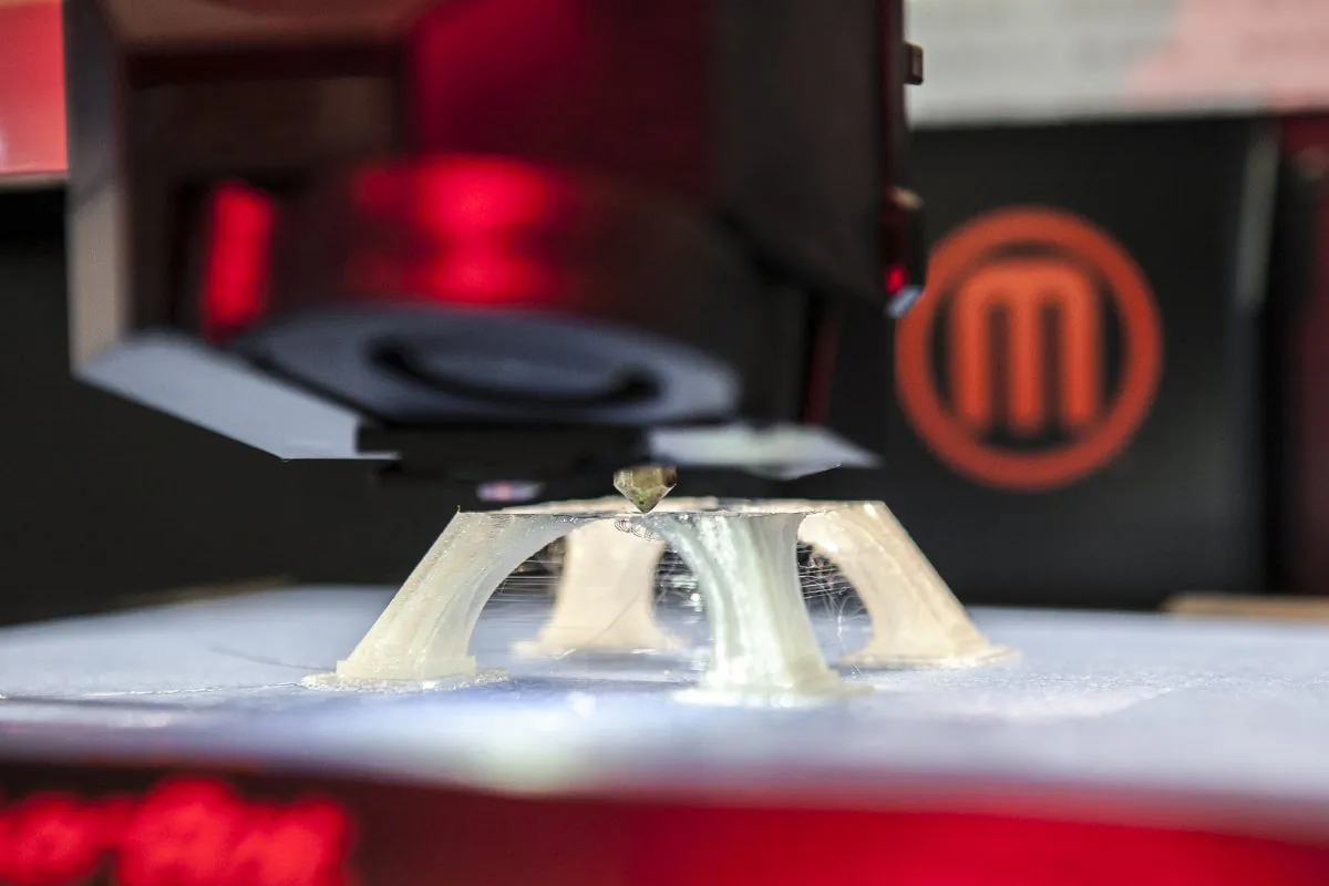 A MakerBot Replicator printing a miniature Eiffel Tower at the MakerBot Retail Store in NoHo, Manhattan, New York, July 14, 2014. (Samira Bouaou/Epoch Times)