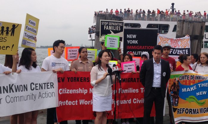 Grace Shim, executive director of the MinKwon Center for Community Action (L) and Steven Choi, executive director of the New York Immigration Coalition (R), at an immigration reform press conference in Lower Manhattan, New York, Monday, July 14, 2014. (Yi Yang/Epoch Times)