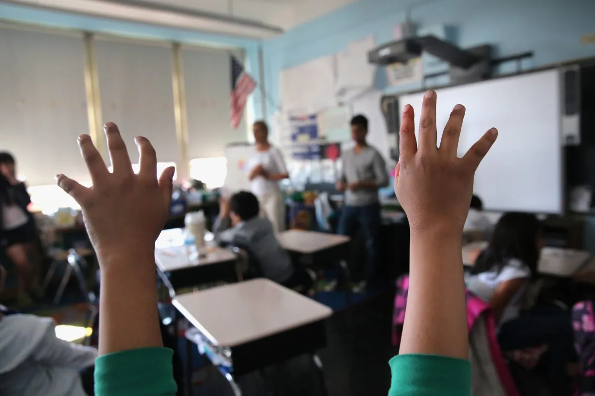 Tibetan immigrant children ask questions during an after-school program for asylum immigrants run by the International Rescue Committee (IRC), on April 25, 2013 in the Queens borough of New York City. (John Moore/Getty Images)