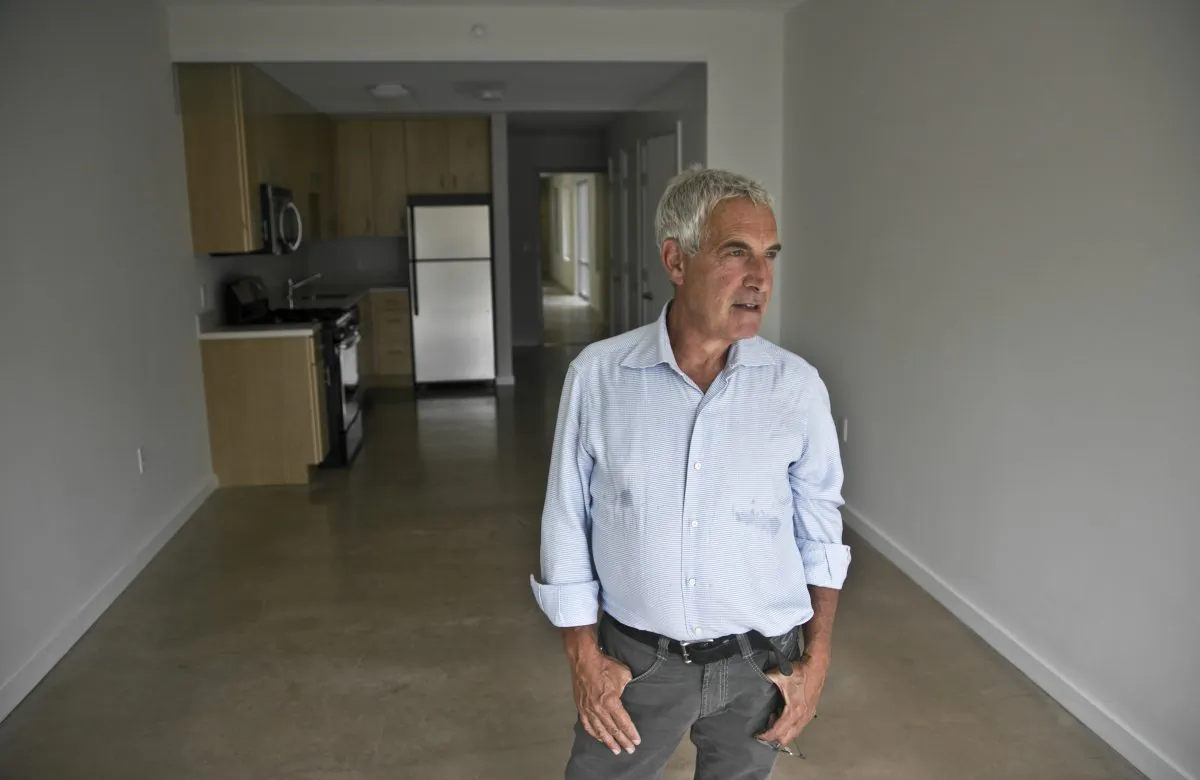 Developer Jeffrey M. Brown tours a studio apartment in the seven-story modular-built apartment building called the Stack he co-developed, in the Innwood neighborhood of Manhattan on July 9, 2014. The Stack's 28 apartments, from studios to three bedroom, were formed from 59 modules of rectangular components all 12.5 feet wide and 50 to 60 feet long. (AP Photo/Bebeto Matthews)