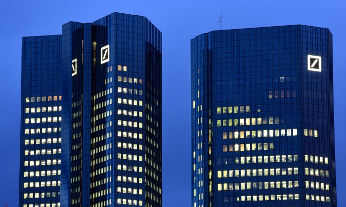 The Deutsche Bank AG headquarters stands illuminated in the twilight on January 09, 2014 in Frankfurt am Main, Germany. (Thomas Lohnes/Getty Images) 