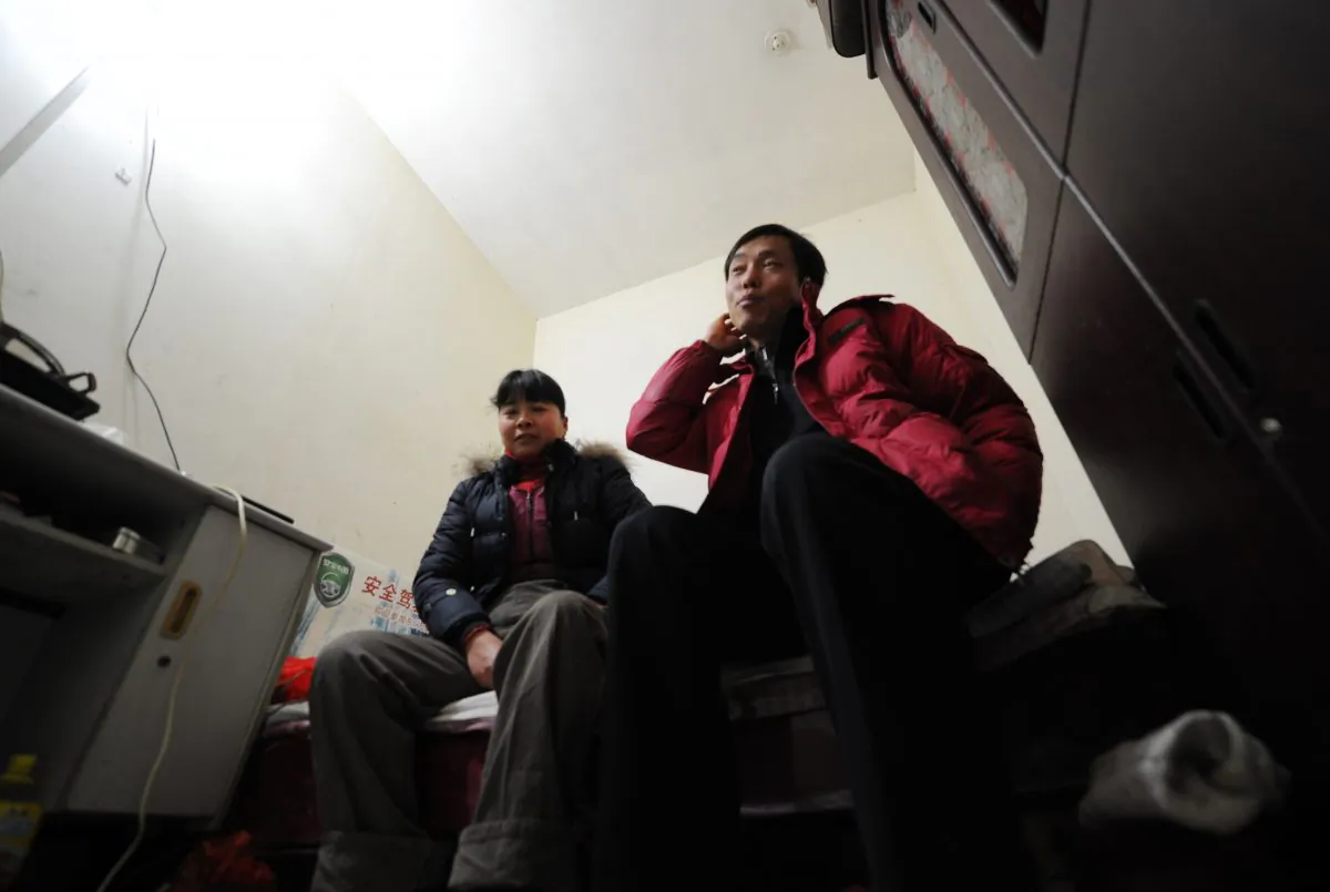 Chinese migrant workers sit in their tiny room, three stories down in a dimly lit air raid shelter in Beijing. These workers belong to what Beijing citizens are now referring to as the “rat tribe.” (Peter Parks/AFP/Getty Images)