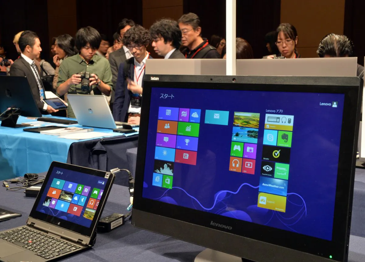 US software giant Microsoft pre-installed Windows 8.1 personal computers and tablets are displayed at a Windows 8.1 launching event in Tokyo on Oct. 18, 2013. (Yoshikazu Tsuno/AFP/Getty Images)