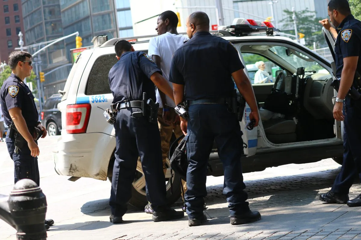 Roaming vendor Mahamadou Soukoua, 21, arrested by police for unlawfully soliciting bicycles and pedicabs without a Department of Consumer Affairs License, Central Park entrance, Wednesday. (Brendon Fallon/Epoch Times)