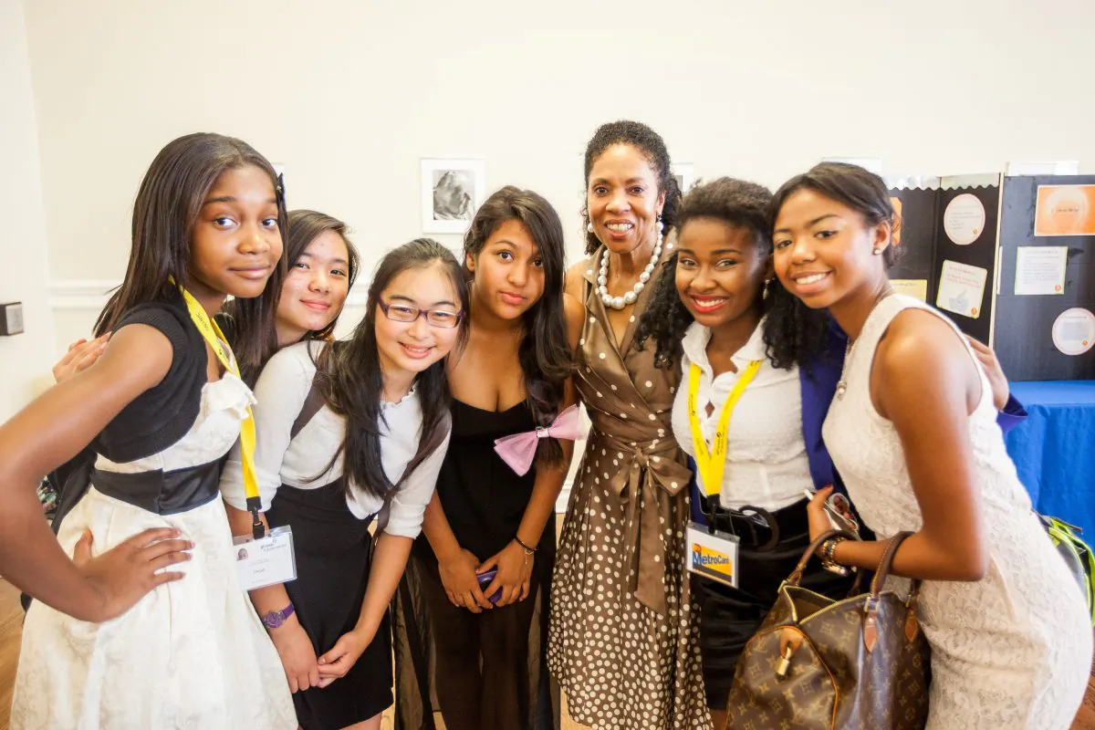 Barbara Murphy-Warrington, chief executive officer of the Girl Scouts of Greater New York, poses for a picture with Girl Scouts members at the Girl Scouts Leadership Institute Entrepreneurship Summer Intensive program at Barnard Hall, New York City, July 24, 2014. (Petr Svab/Epoch Times)