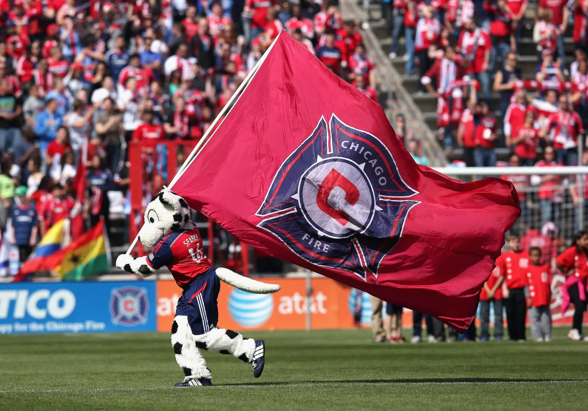 Sparky, the mascot for the Chicago Fire, runs with a flag before an MLS match between the Fire and the New England Revolution at Toyota Park on April19, 2014 in Bridgeview, Illinois. The Fire and the Revolution tied 1-1. (Photo by Jonathan Daniel/Getty Images)