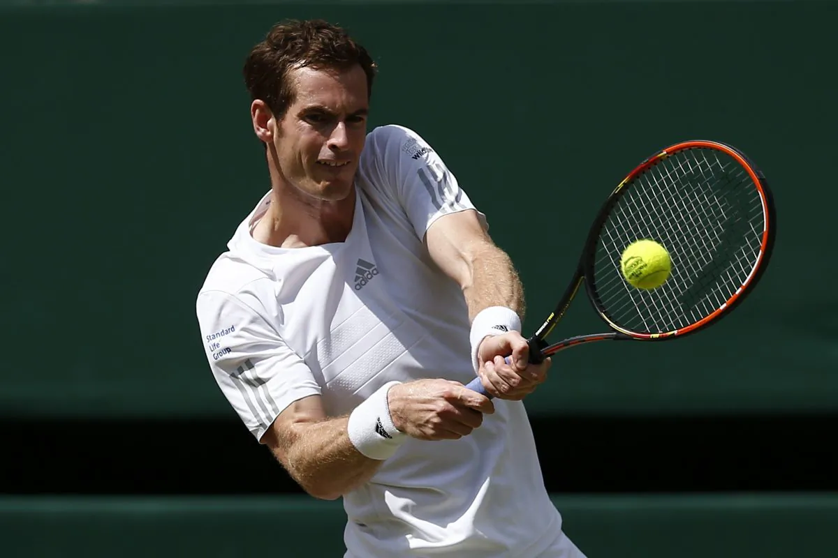 Britain's Andy Murray returns to Bulgaria's Grigor Dimitrov during their men's singles quarter-final match on day nine of the 2014 Wimbledon Championships at The All England Tennis Club in Wimbledon, southwest London, on July 2, 2014. (Andrew Cowie/AFP/Getty Images)