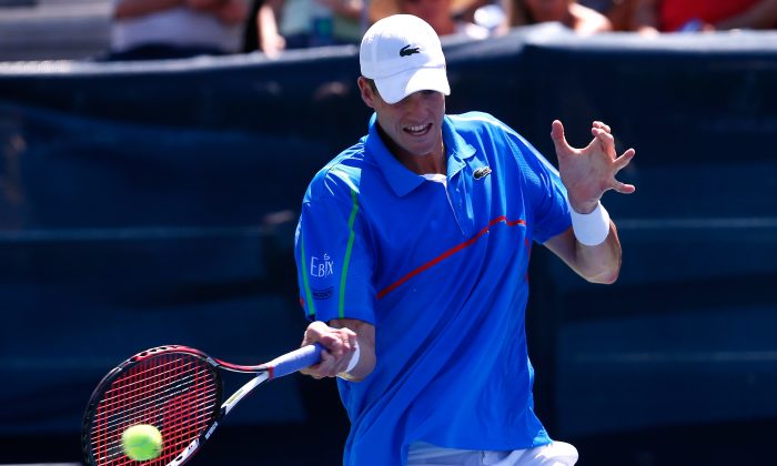  John Isner returns a forehand to Jack Sock during the BB&T Atlanta Open at Atlantic Station on July 26, 2014 in Atlanta, Georgia. (Kevin C. Cox/Getty Images)