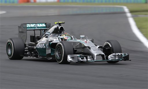 Mercedes driver Nico Rosberg of Germany steers his car during the qualifying of the Hungarian Formula One Grand Prix in Budapest, Hungary, Saturday, July 26, 2014. The Hungarian Grand Prix will be held on Sunday, July 27, 2014. (AP Photo/Petr David Josek)