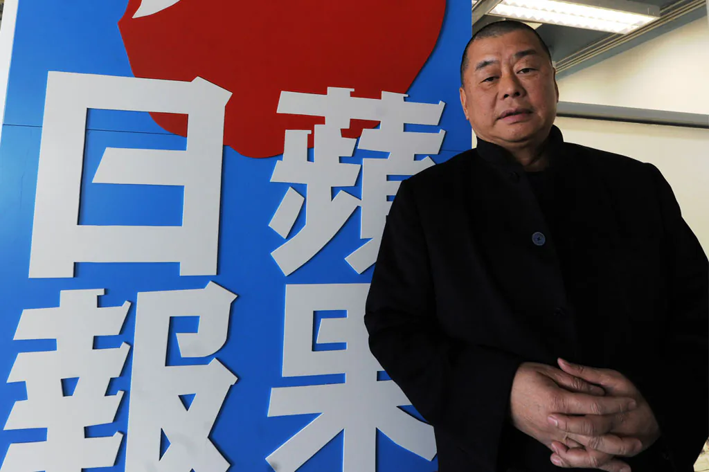 Jimmy Lai stands outside his company's headquarters in Hong Kong, on Feb. 7, 2011. The hacking of almost 900 emails from Lai's company appears to be an effort by the Chinese regime to embarrass Lai. (Mike Clarke/AFP/Getty Images)
