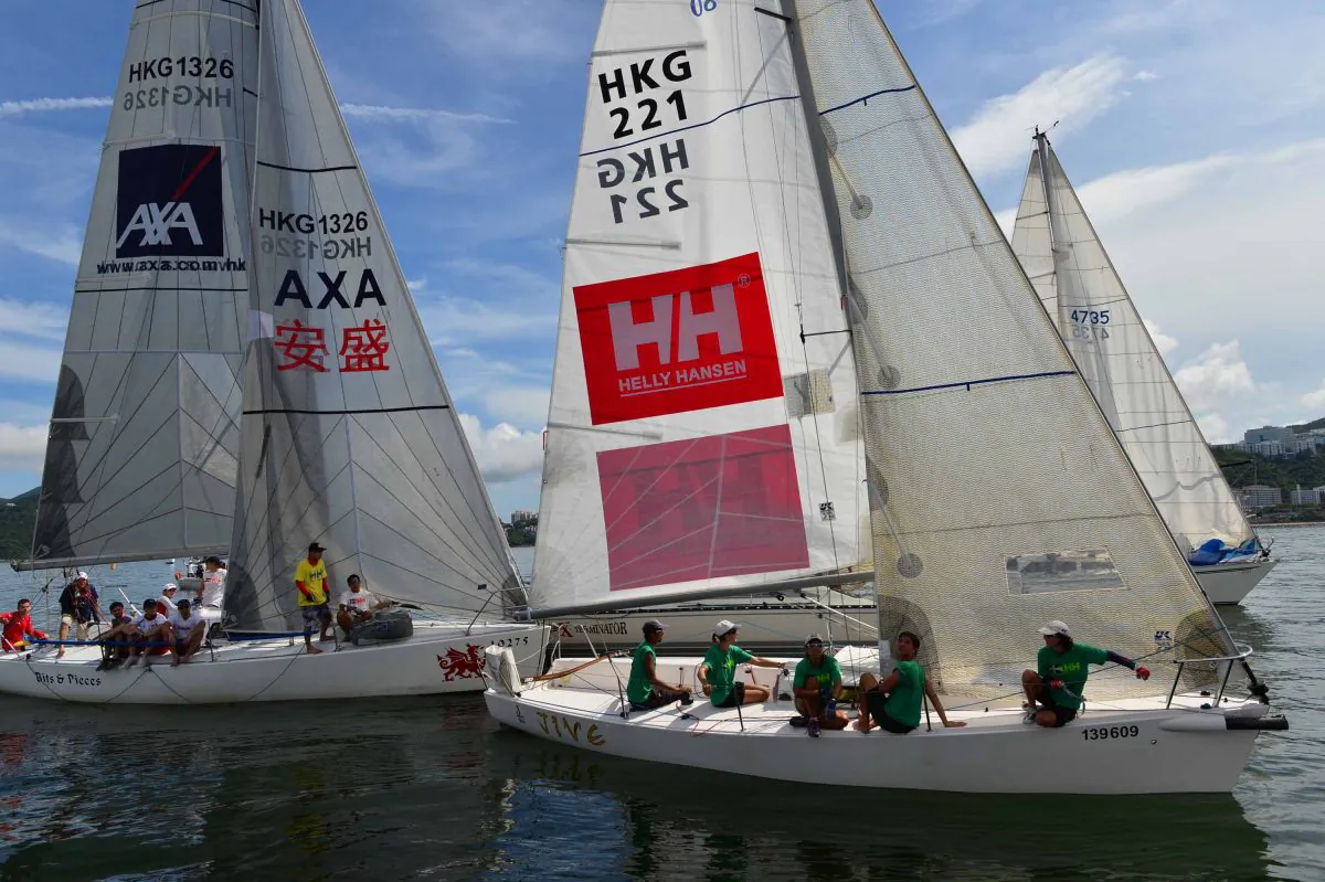 Helly Hansen title sponsored boat ‘Jive’ tries to get some motion at the start of the HKPN Race-7 of the Summer Saturday Series to start on Saturday July 26, 2014. After some delay and an unsuccessful attempt to run the race, racing for the day was cancelled due to insufficient wind. (Bill Cox/Epoch Times)