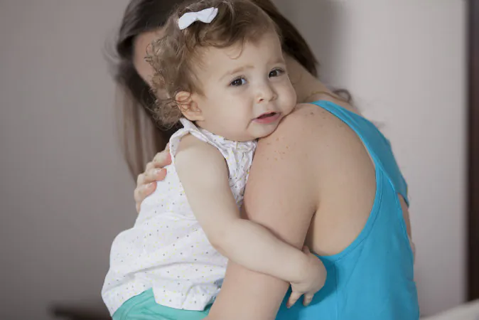 Stock photo of a mother holding her child. (Shutterstock)