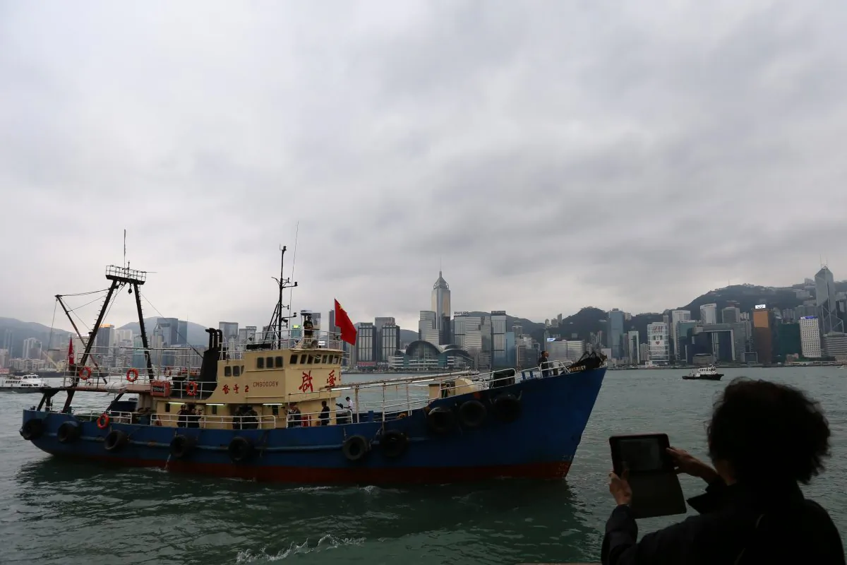A Chinese fishing boat, which landed on one of Japan's Senkaku islands, sails into Victoria Harbor in Hong Kong on November 13, 2013. Through a new system, China is militarizing its fishing ships. (Aaron Tam/AFP/Getty Images) 