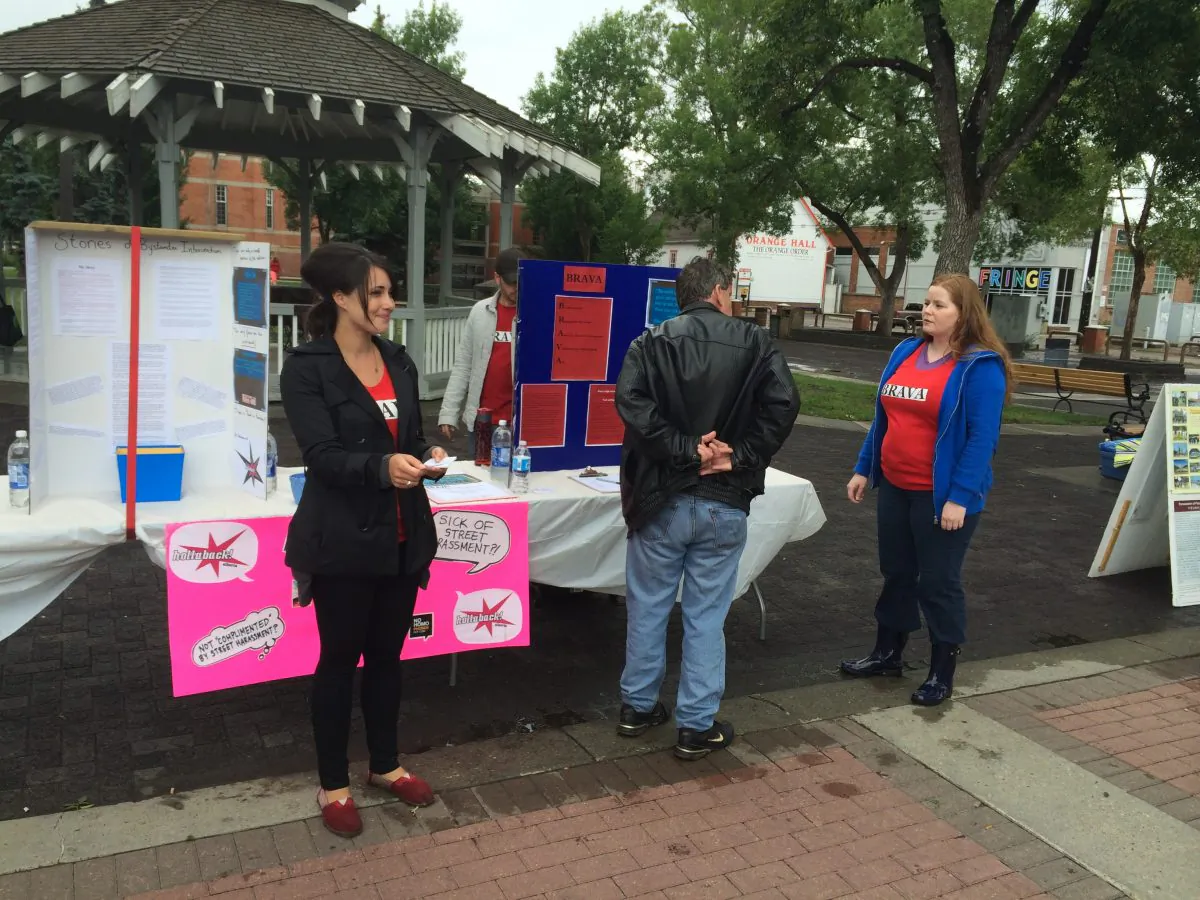 Karina Murray (L) and other volunteers raise awareness about responsible bystander intervention at the Dr. Wilbert Mcintyre Park in Edmonton on July 26, 2014. (Omid Ghoreishi/Epoch Times)