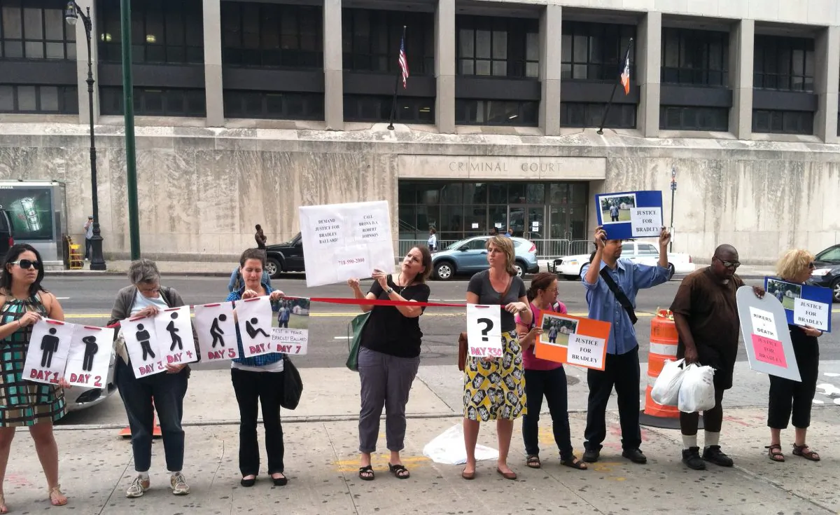 Advocates call for the prosecution of Rikers Island officers who were responsible for the death of a mentally ill inmate, in front of the Bronx, New York district attorney's office on Thursday, July 31, 2014. Bradley Ballard died last September after spending seven days in solitary confinement without access to his medication. (Annie Wu/Epoch Times)