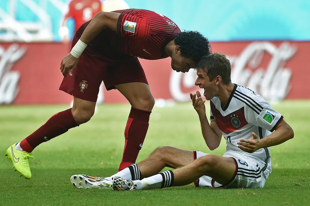Portugal's defender Pepe (R) fouls Germany's forward Thomas Mueller before being sent off during the Group G football match between Germany and Portugal at the Fonte Nova Arena in Salvador during the 2014 FIFA World Cup on June 16, 2014. (PATRIK STOLLARZ/AFP/Getty Images)