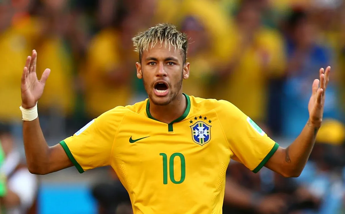 Neymar of Brazil celebrates after defeating Chile in a penalty shootout during the 2014 FIFA World Cup Brazil round of 16 match between Brazil and Chile at Estadio Mineirao on June 28, 2014 in Belo Horizonte, Brazil. (Photo by Ronald Martinez/Getty Images)