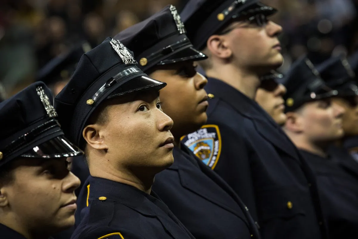 The 2014 class of the New York Police Department (NYPD) attend the NYPD graduation ceremony on June 30, 2014 at Madison Square Garden in New York City. The NYPD, which has over 35,000 officers, graduated 604 new officers today. (Andrew Burton/Getty Images)