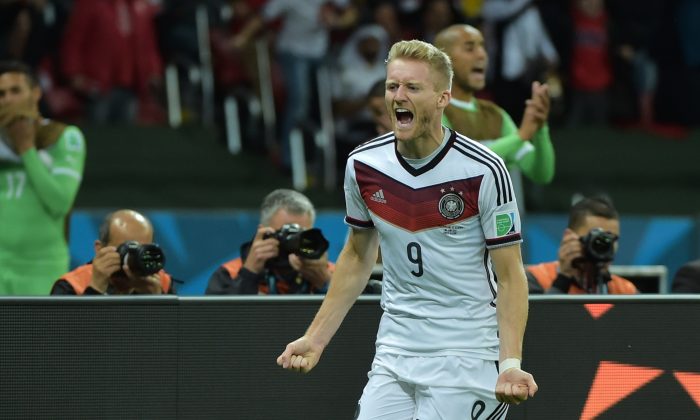 Germany's forward Andre Schuerrle celebrates after scoring a goal during the first half of extra-time in the Round of 16 football match between Germany and Algeria at Beira-Rio Stadium in Porto Alegre during the 2014 FIFA World Cup on June 30, 2014. (GABRIEL BOUYS/AFP/Getty Images)