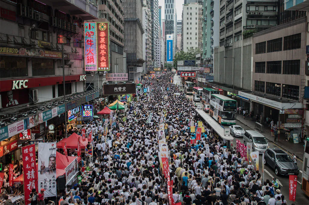 Demonstrators march during a pro-democracy rally seeking greater democracy in Hong Kong on July 1, 2014 as frustration grows over the influence of Beijing on the city. July 1 is traditionally a day of protest in Hong Kong and also marks the anniversary of the handover from Britain to China in 1997, under a 'one country, two systems' agreement. (Philippe Lopez/AFP/Getty Images)