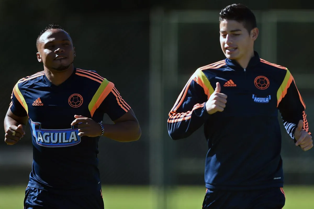 Colombia's defender Juan Camilo Zuniga (L) and midfielder James Rodriguez take part in a training session at the President Laudo Natel Athlete Formation Center in Cotia, Sao Paulo, on July 1, 2014, during the 2014 FIFA World Cup in Brazil. (EITAN ABRAMOVICH/AFP/Getty Images)