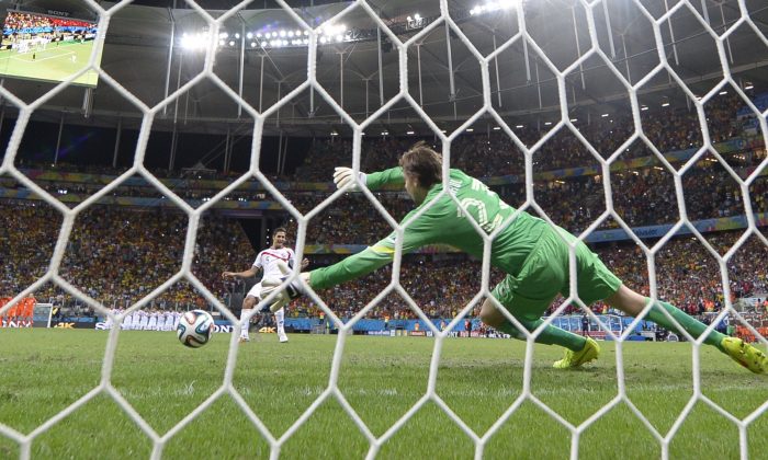 Netherlands' goalkeeper Tim Krul (R) fails to make a save from Costa Rica's midfielder Celso Borges during a penalty shoot-out after extra-time during a quarter-final football match between Netherlands and Costa Rica at the Fonte Nova Arena in Salvador during the 2014 FIFA World Cup on July 5, 2014. (FABRICE COFFRINI/AFP/Getty Images)