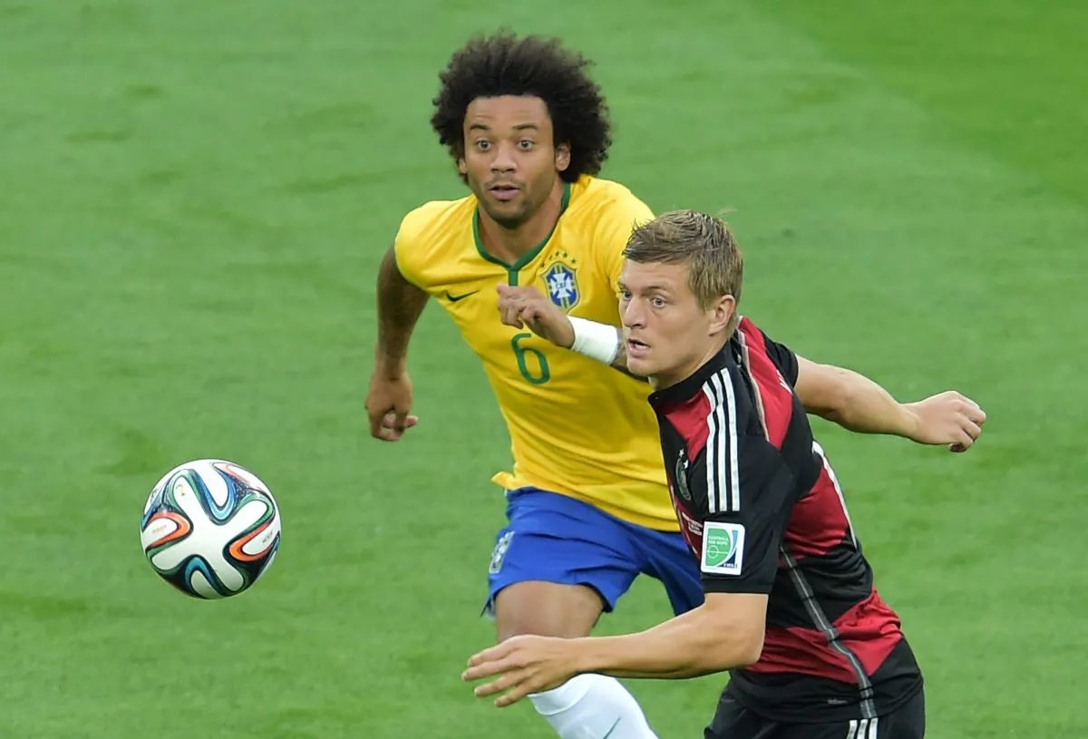Brazil's defender Marcelo (L) vies with Germany's midfielder Toni Kroos during the semi-final football match between Brazil and Germany at The Mineirao Stadium in Belo Horizonte during the 2014 FIFA World Cup on July 8, 2014. (GABRIEL BOUYS/AFP/Getty Images)