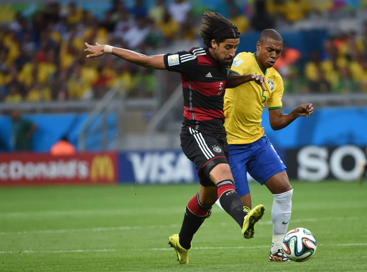 Brazil's midfielder Fernandinho (R) challenges Germany's midfielder Sami Khedira during the semi-final football match between Brazil and Germany at The Mineirao Stadium in Belo Horizonte on July 8, 2014, during the 2014 FIFA World Cup . (PEDRO UGARTE/AFP/Getty Images)