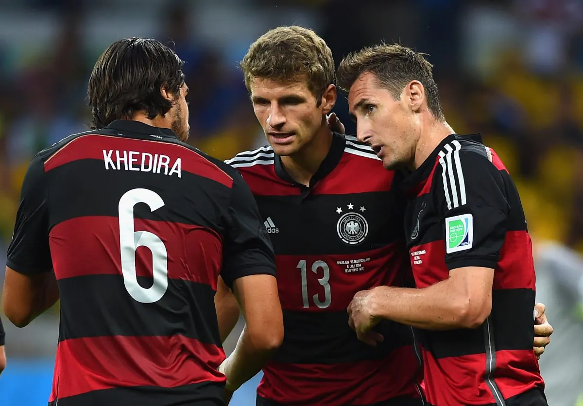 Miroslav Klose of Germany (R) celebrates scoring his team's second goal with teammates Sami Khedira (L) and Thomas Mueller during the 2014 FIFA World Cup Brazil Semi Final match between Brazil and Germany at Estadio Mineirao on July 8, 2014 in Belo Horizonte, Brazil. (Laurence Griffiths/Getty Images)