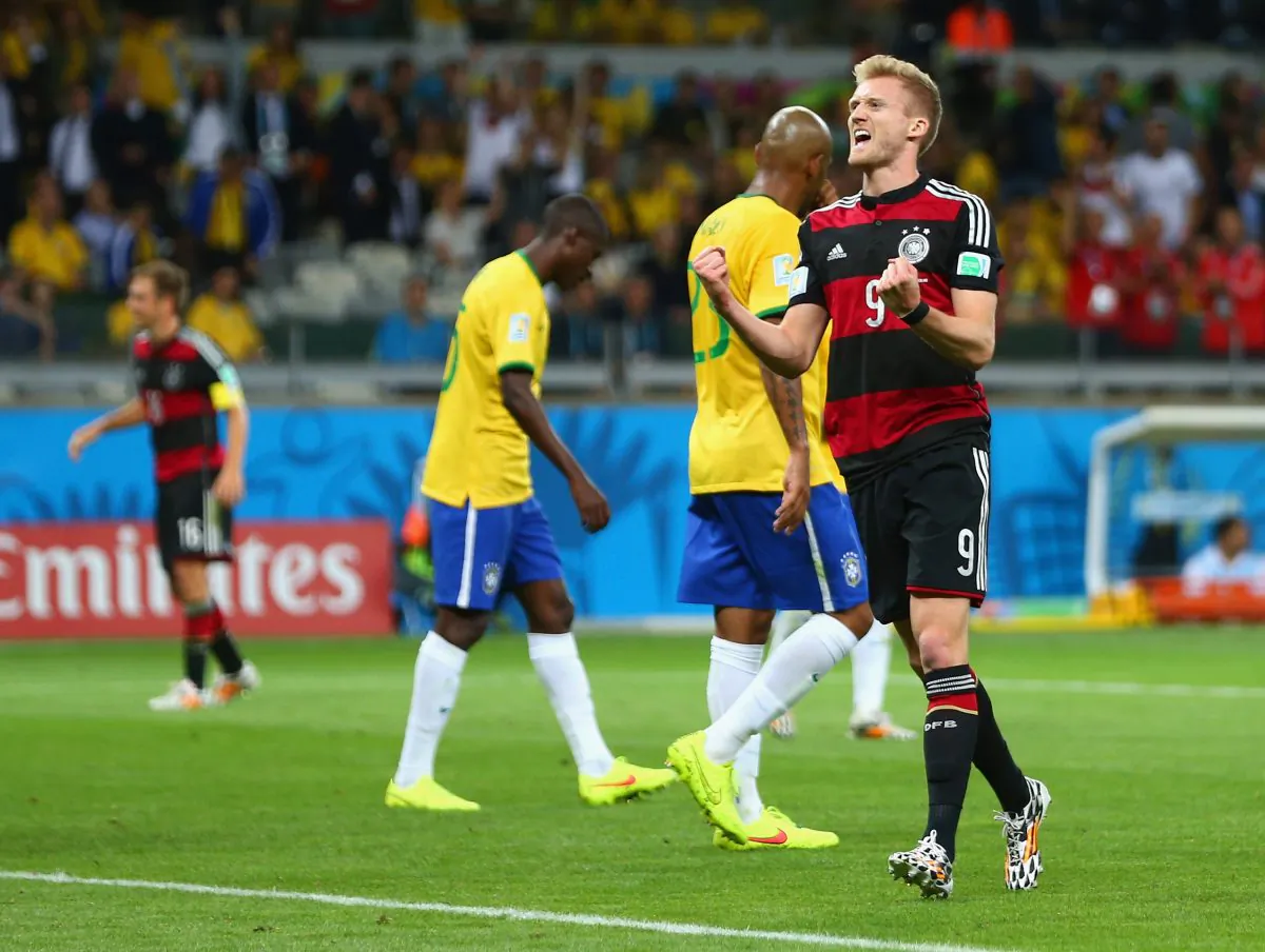 Andre Schuerrle of Germany celebrates scoring his team's sixth goal during the 2014 FIFA World Cup Brazil Semi Final match between Brazil and Germany at Estadio Mineirao on July 8, 2014 in Belo Horizonte, Brazil. (Michael Steele/Getty Images)