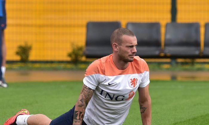 Netherlands' midfielder Wesley Sneijder stretches on the training pitch at The Estádio Paulo Machado de Carvalho (Pacaembu) in Sao Paulo on July 10, 2014, ahead of their third place play-off against host nation Brazil in the 2014 FIFA World Cup. Despite their World Cup semi-final elimination on penalties by Argentina, the Netherlands and their coach Louis van Gaal will move on from the tournament with their reputations unquestionably enhanced. (NELSON ALMEIDA/AFP/Getty Images)