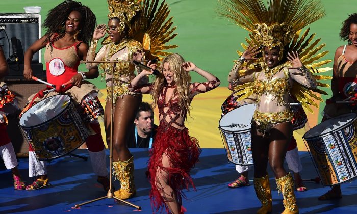 Colombian singer Shakira (R) performs during a closing ceremony ahead of the final football match between Germany and Argentina for the FIFA World Cup at The Maracana Stadium in Rio de Janeiro on July 13, 2014. (GABRIEL BOUYS/AFP/Getty Images)