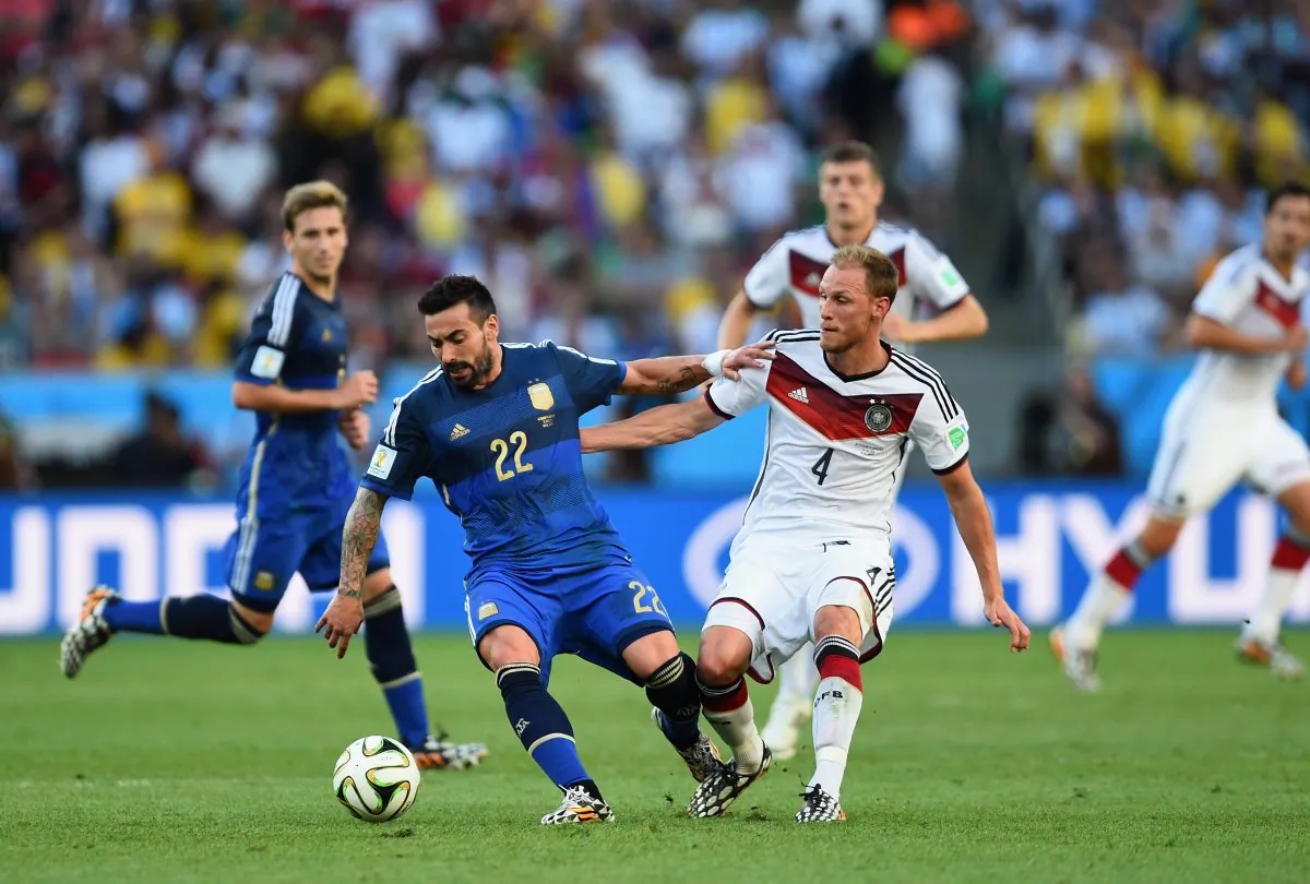 Ezequiel Lavezzi of Argentina competes for the ball with Benedikt Hoewedes of Germany during the 2014 FIFA World Cup Brazil Final match between Germany and Argentina at Maracana on July 13, 2014 in Rio de Janeiro, Brazil. (Jamie McDonald/Getty Images)