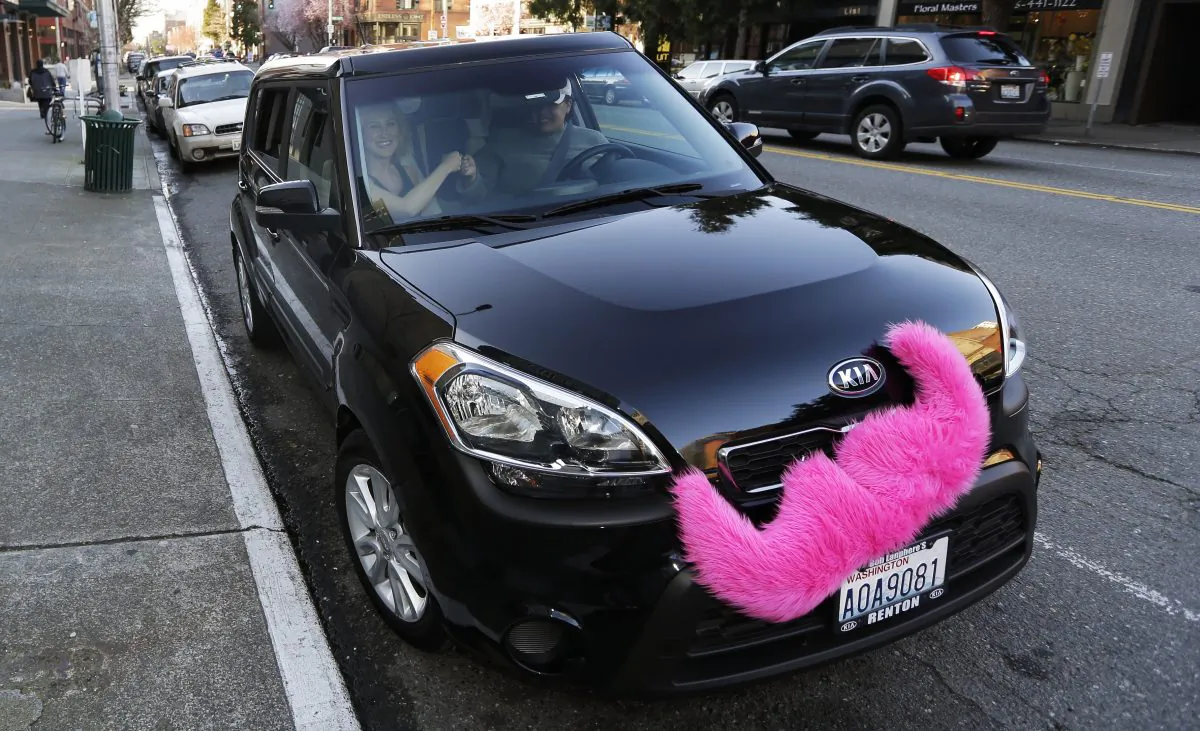 A car adorned with Lyft's signature mustache in Seattle on March 12. (AP Photo/Ted S. Warren)