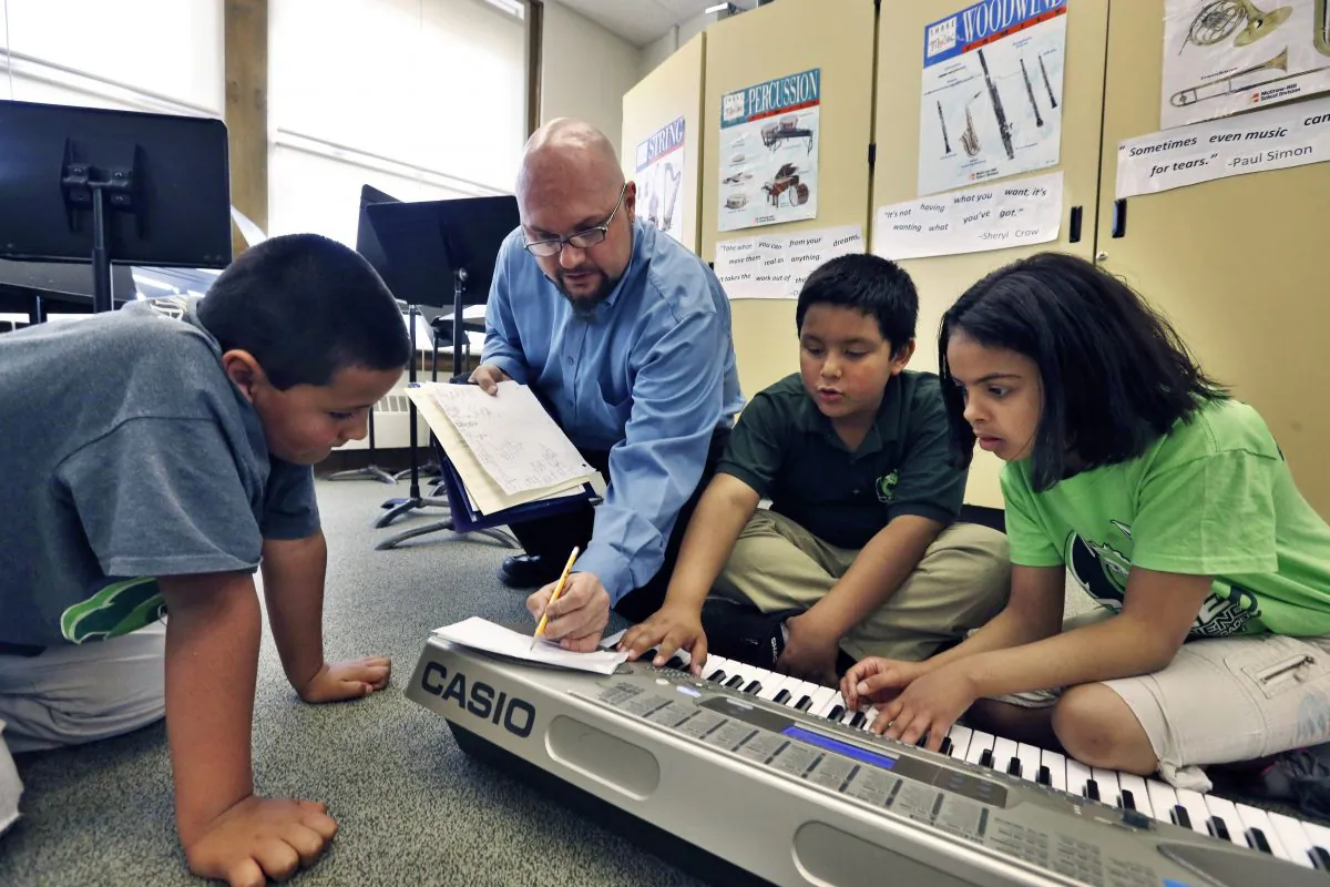 Students learn music composition at Cole Elementary school in Denver, Colo., April 22. (Brennan Linsley/AP)