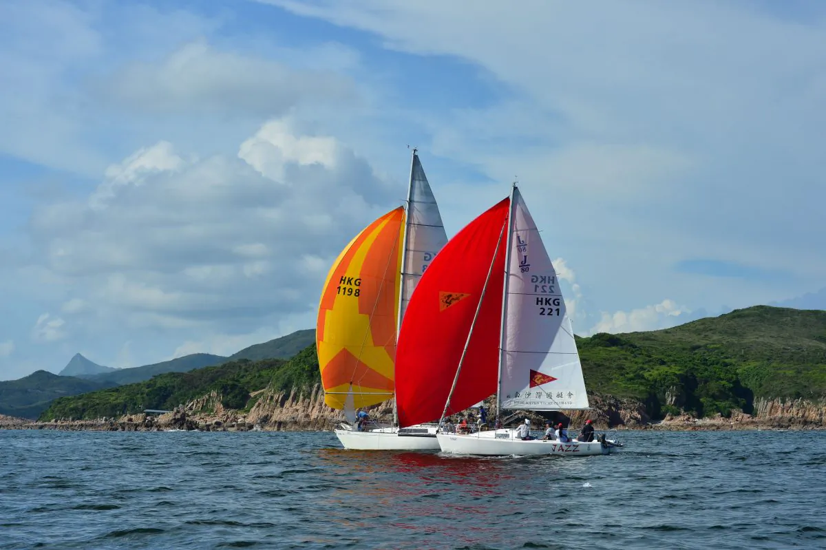 “Jazz” and “Windseeker” head downwind from Bluff Island to the Bay Island Mark during “The Short Course Dash” on Day-3 of the Hebe Haven Summer Saturday Series on Saturday July 12, 2014. (Bill Cox/Epoch Times)