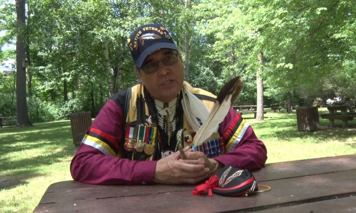 Earl Robert Crane speaks on the relationship between Canada and its original peoples during the Aboriginal Festival and Competition Powwow in Ottawa in June 2014. Crane believes Aboriginal Peoples are nearing a time when they can assert their legal rights in a more significant way. (Matthew Little/Epoch Times)
