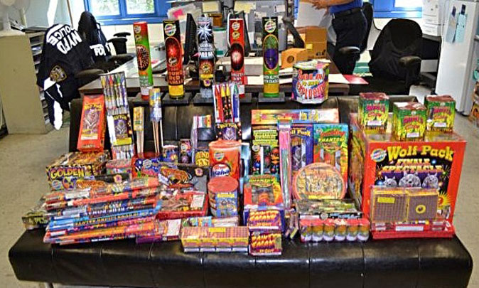 A large assortment of illegal fireworks is displayed on a table in New York, July 3, 2013. The fireworks valued at $1,600 were seized when police arrested two individuals in the Bronx borough of New York who were trying to sell them on Craigslist. (AP Photo/New York Police Department)