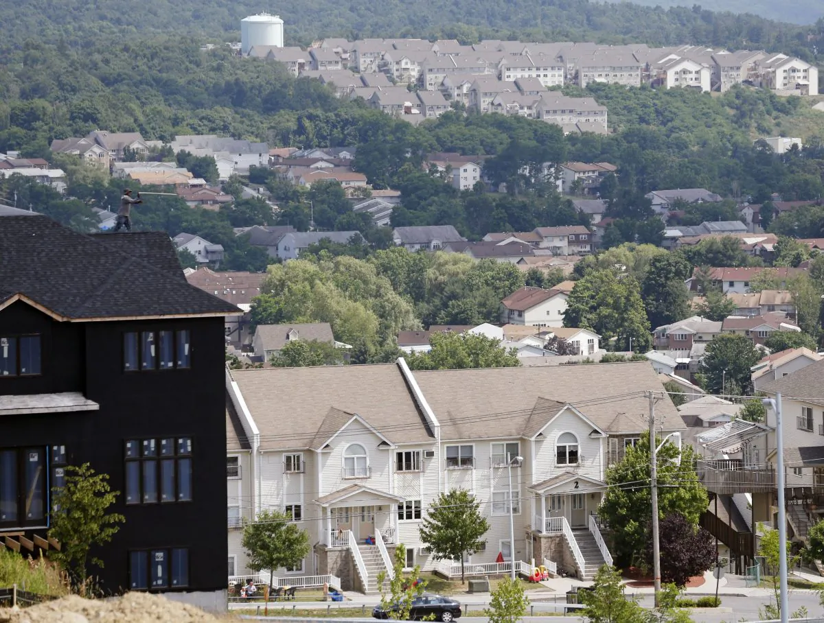 A new housing unit (L) is under construction in Kiryas Joel on July 1, 2014. (Mike Groll/AP)
