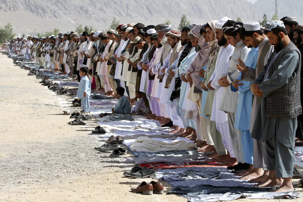 Afghan men attend Eid al-Fitr prayers in Kandahar south of Kabul, Afghanistan, Monday, July 28, 2014. (AP Photo/Allauddin Khan)