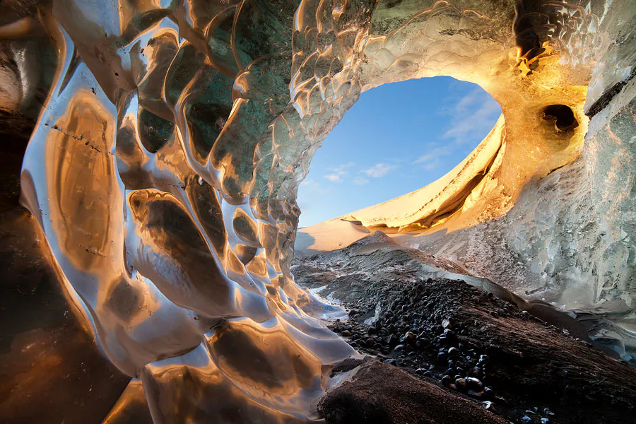"Nautilus.” Photographer Erez Marom describes this scene: “One of the most amazing sights I’ve seen in Iceland was the opening to this ice cave in Vatnajökull Glacier. The patterns, colors, and reflections were mind boggling, and conveyed the true sensation of being inside a natural wonder.” (Erez Marom)