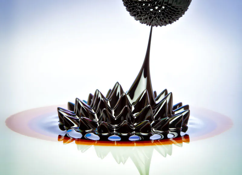 Macro photograph of Ferrofluid flowing from one magnet to another. Ferrofluid is a colloidal liquid of nanoscale particles in a carrier fluid that becomes magnetized by approaching a magnet. Liquids behave oddly at the nanoscale. Water, for example, seems to flow much faster within carbon nanotubes than classical physics says should be possible. (Shutterstock*)