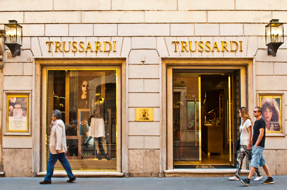 People walking and looking at Trussardi store at Via dei Condotti in Rome, Italy. (*Shutterstock)
