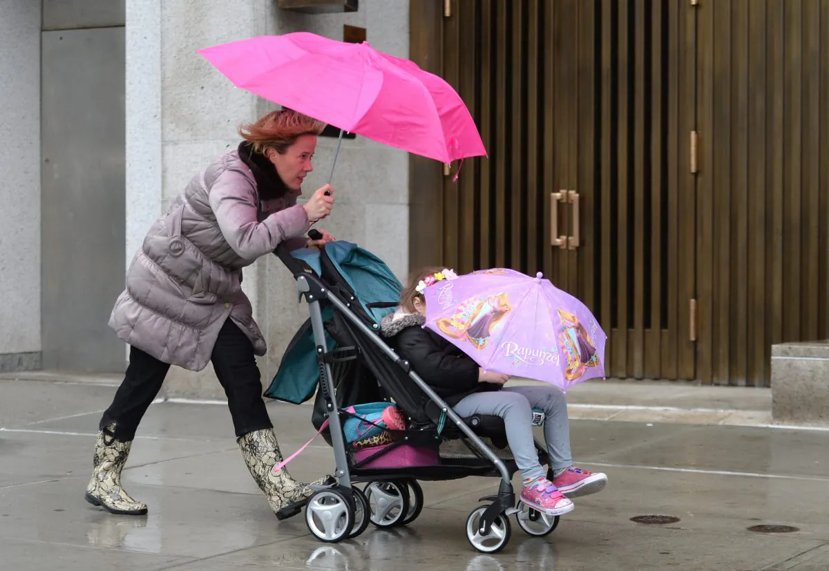 A woman pushes a stroller across First Avenue in New York in April 2014. Generation X tend to value family and that should be a major consideration for marketers. (Stan Honda/AFP/Getty Images)
