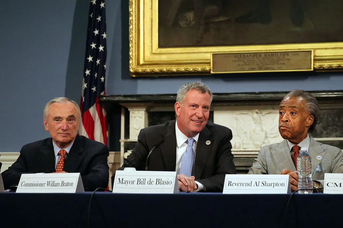 New York Mayor Bill de Blasio is joined by the Rev. Al Sharpton (R) and Police Commissioner Bill Bratton at City Hall for a roundtable discussion on police-community relations following the death of Eric Garner while in police custody, on Staten Island, N.Y., July 31, 2014. (Spencer Platt/Getty Images)