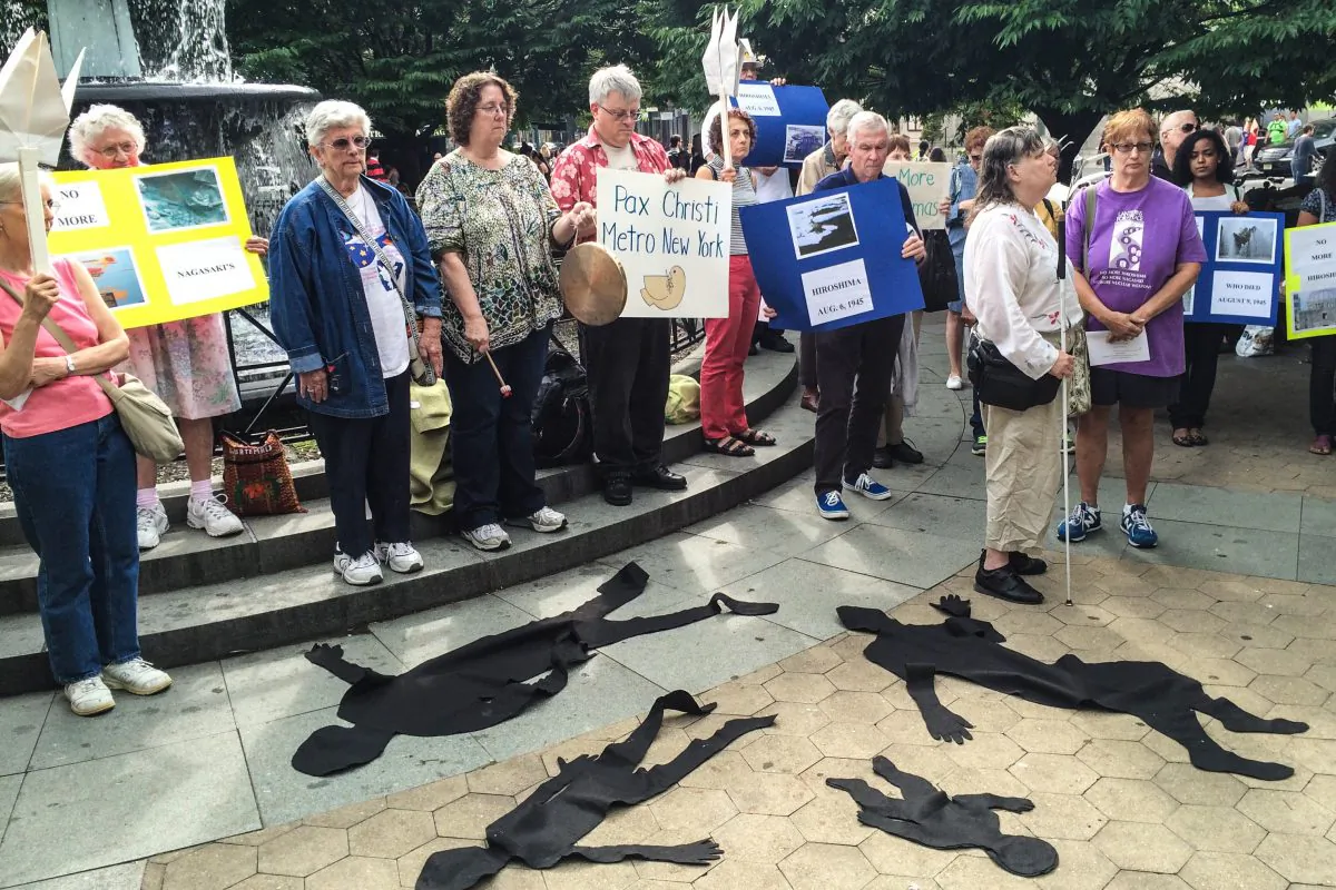 New Yorkers commemorate the 69th anniversary of the atomic bombing of Hiroshima and Nagasaki with prayer and the sounding of the gong for every year since, at Father Demo Square, N.Y., on August 3, 2014. (Jonathan Zhou/Epoch Times)