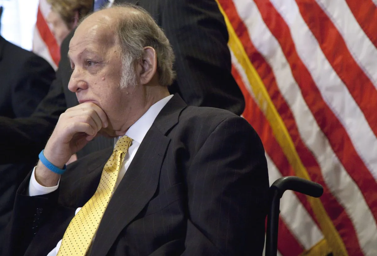 This March 30, 2011 photo shows former White House press secretary James Brady who was left paralyzed in the Reagan assassination attempt during a news conference on Capitol Hill in Washington marking the 30th anniversary of the shooting. A Brady family spokeswoman says Brady has died at 73. (AP Photo/Evan Vucci)