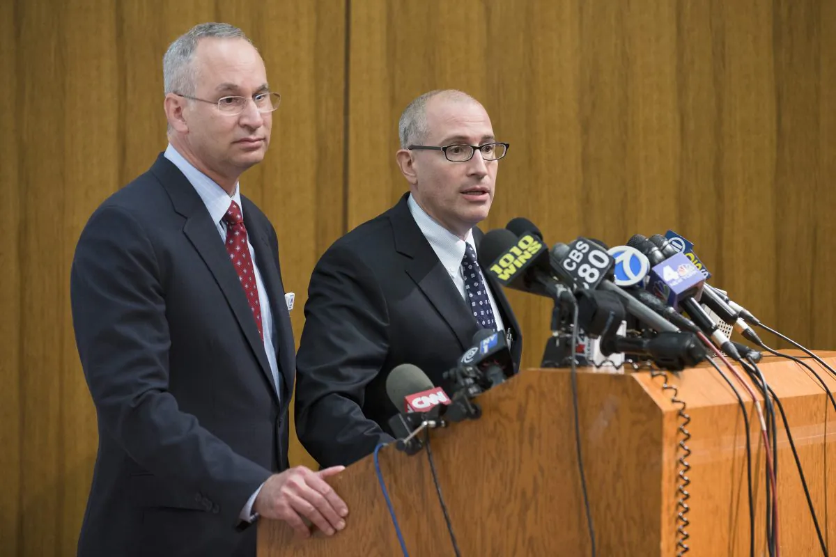 Jeremy Boal, Chief Medical Officer for the Mount Sinai Health System (C), speaks during a news conference alongside David Reich, President of Mount Sinai Hospital (L), at Mount Sinai Medical Center, where a male patient with a high fever and gastrointestinal symptoms is undergoing testing in New York City for the Ebola virus, following a recent trip to West Africa, Aug. 4. (AP Photo/John Minchillo)
