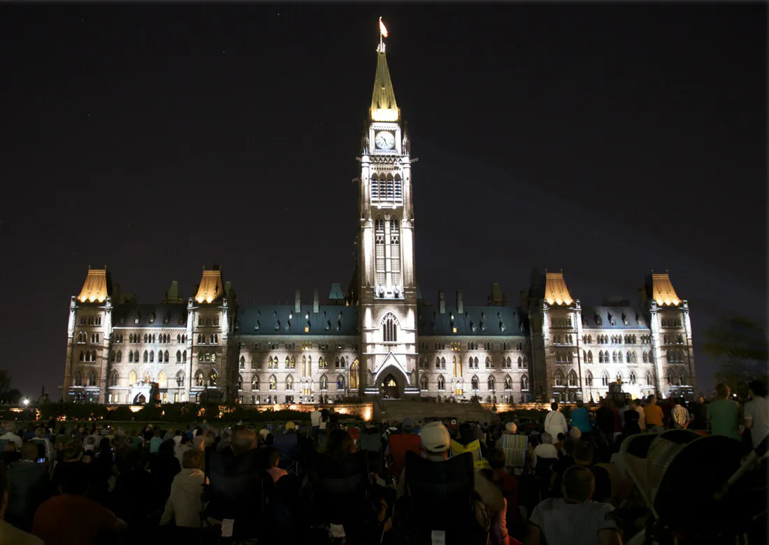 The Centre Block of Canada's Parliament buildings lights up with scenes from Canada's history in the free sound and light show, Mosaika. (Matthew Little/Epoch Times)